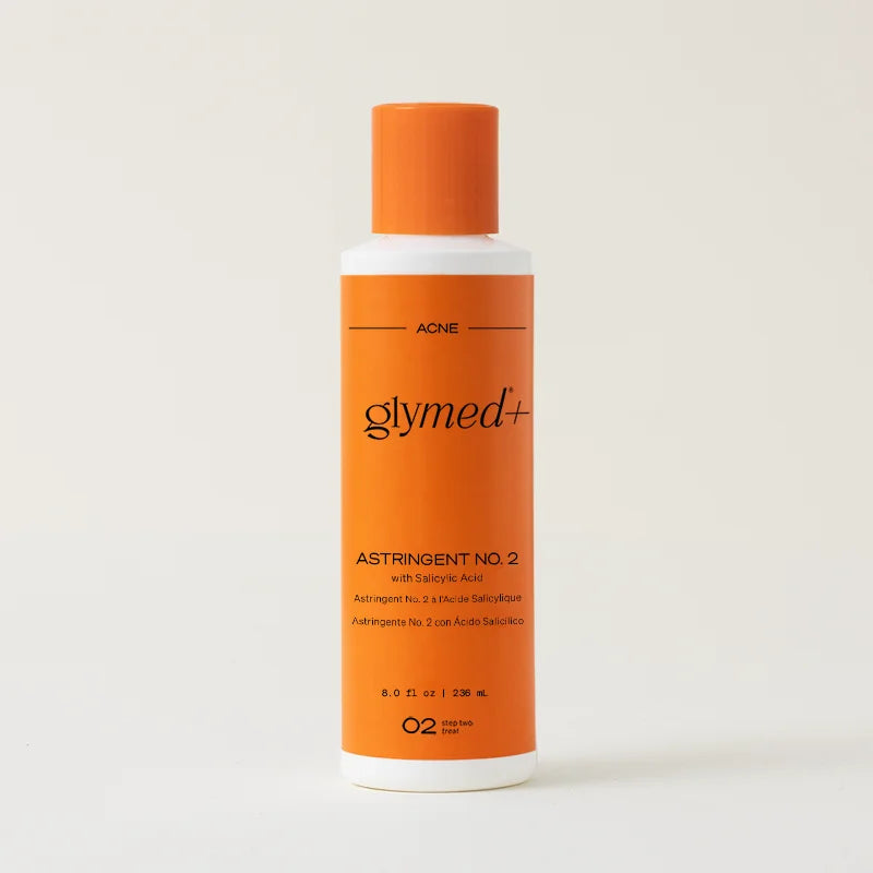 Orange bottle of Glymed+Astringent No. 2 on a light gray background